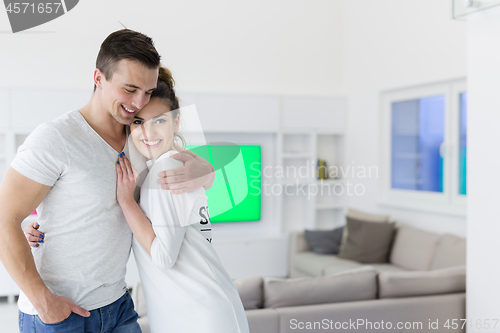 Image of couple hugging in their new home