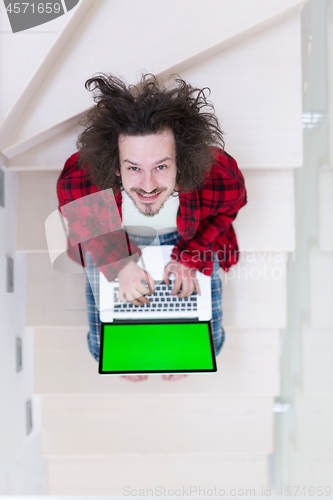 Image of freelancer in bathrobe working from home