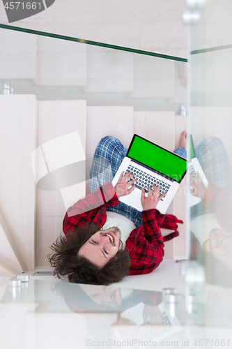 Image of freelancer in bathrobe working from home