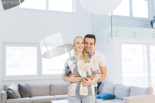 Image of couple hugging in their new home