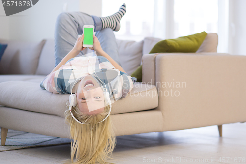 Image of girl enjoying music through headphones