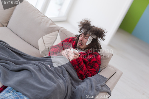 Image of young Man with flu and fever