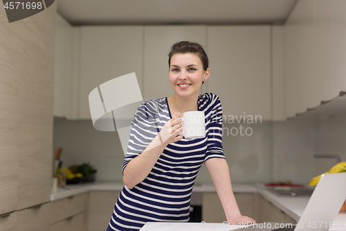 Image of woman drinking coffee enjoying relaxing lifestyle