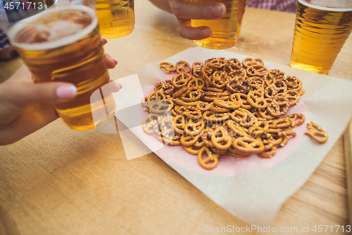 Image of beer and pretzels. Perfect for Octoberfest. Natural wooden background.