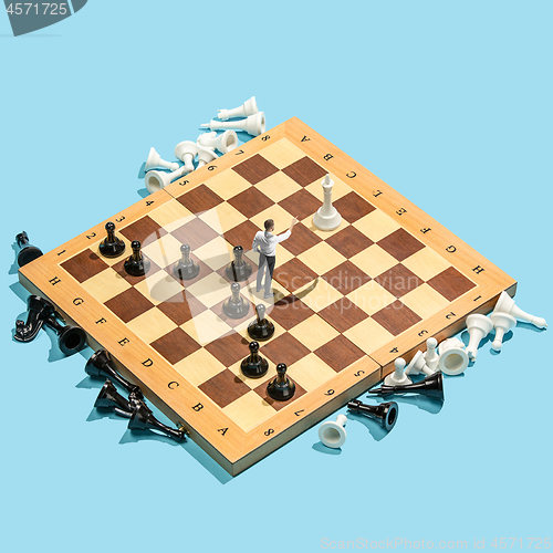 Image of Business decision making concept. Miniature people : small businessman figure standing and walking on chessboard with chess pieces