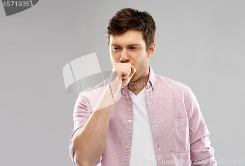 Image of unhealthy young man coughing