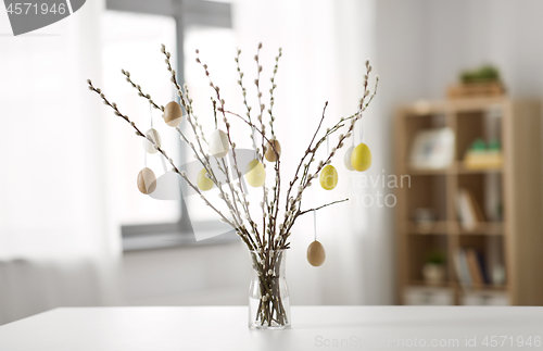 Image of pussy willow branches decorated by easter eggs