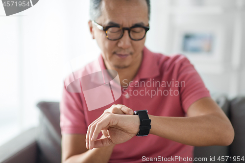 Image of close up of man with smart watch