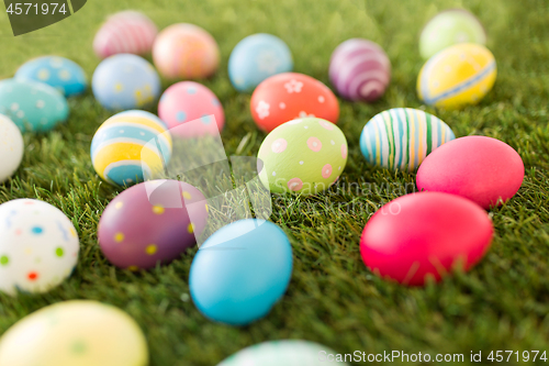 Image of colored easter eggs on artificial grass