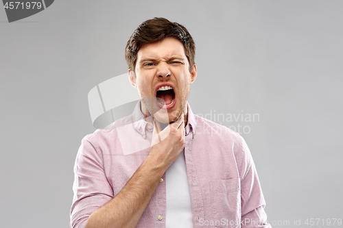 Image of screaming man suffering from sore throat