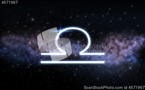 Image of libra zodiac sign over night sky and galaxy