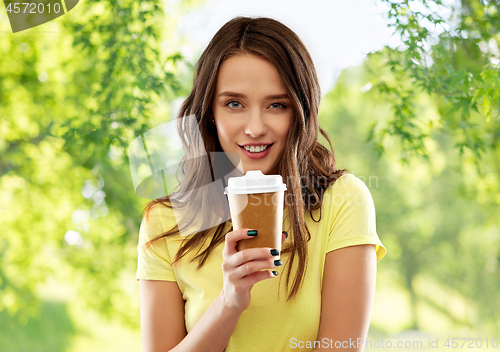 Image of young woman or teenage girl drinking coffee