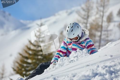 Image of Skier having a rest in the snow