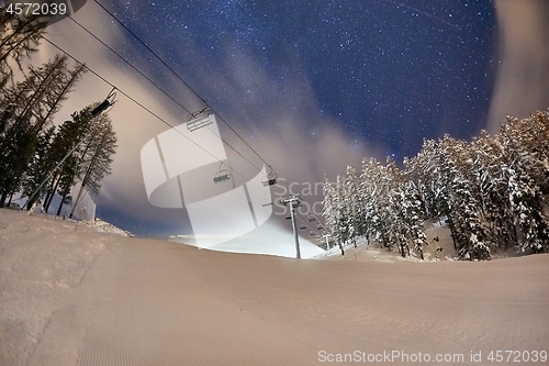 Image of Ski lift at night under the stars in the sky