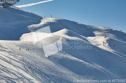 Image of Skiing slopes in snowy mountains