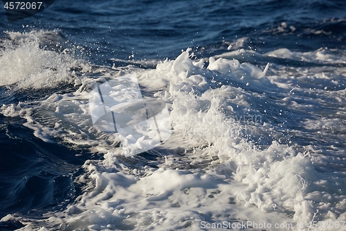 Image of Waves with foam splasing in sea water