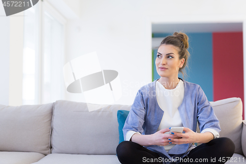 Image of woman using mobile phone