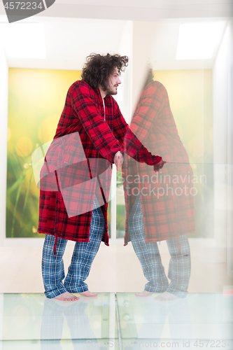 Image of portrait of young man in bathrobe