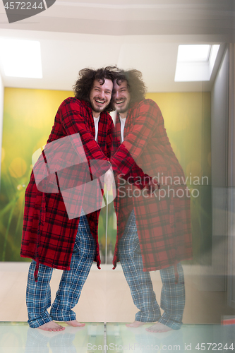 Image of portrait of young man in bathrobe