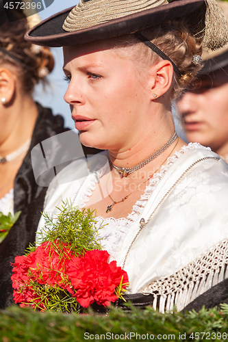 Image of Warngau, Germany, Bavaria 10/27/2019: Young woman in traditional costume at the Leonhardifahrt Warngau