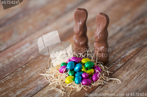 Image of easter eggs in straw nest and chocolate bunnies