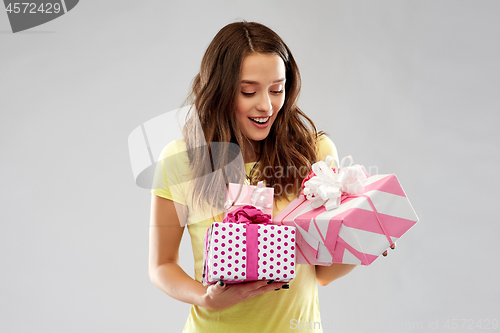 Image of young woman or teenage girl with birthday gifts