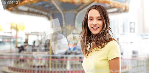 Image of young woman or teenage girl in yellow t-shirt