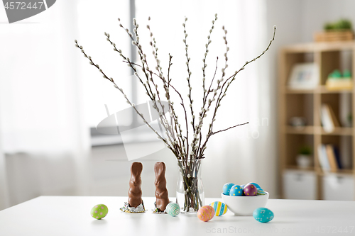 Image of pussy willow, easter eggs and chocolate bunnies