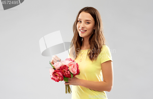 Image of young woman or teenage girl with flower bouquet