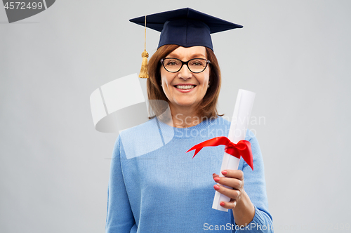 Image of happy senior graduate student woman with diploma