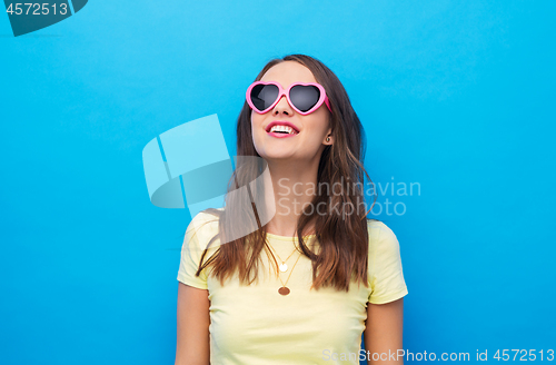 Image of teenage girl in heart-shaped sunglasses