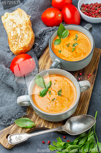 Image of Tomato soup with cream and basil.