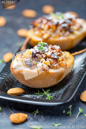 Image of Pears baked in honey with raisins and nuts.