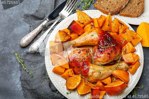 Image of Chicken thighs and baked pumpkin.