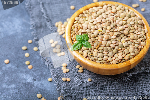 Image of Bowl of brown lentils. Vegetarian food.