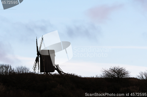 Image of Silhouetted old wooden windmill