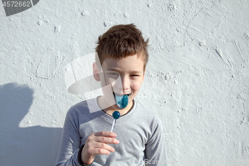 Image of Boy with blue lollipop