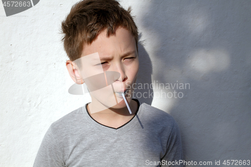 Image of Boy with blue lollipop