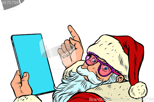 Image of Santa Claus with a tablet. New year and Christmas online sales concept