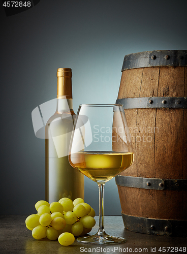 Image of glass and bottle of white wine