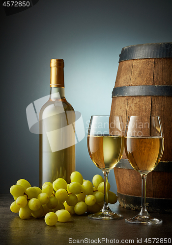 Image of glass and bottle of white wine