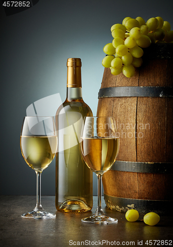 Image of glass and bottle of white wine