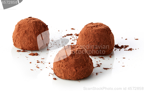 Image of chocolate truffles covered with cocoa