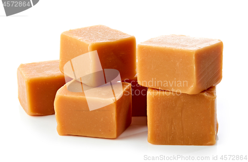 Image of caramel candies on white background