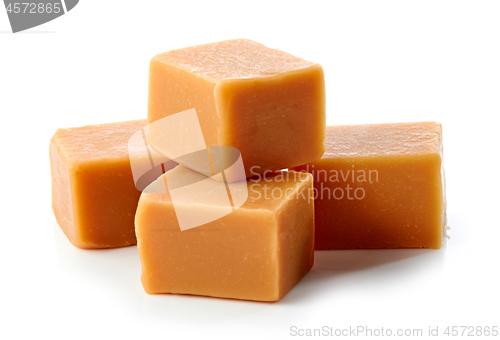 Image of caramel candies on white background