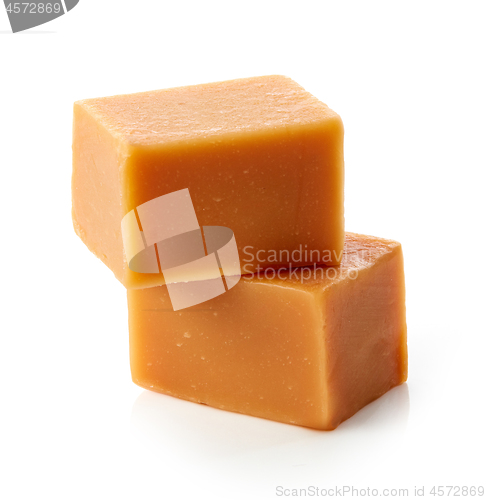 Image of caramel candies on white background