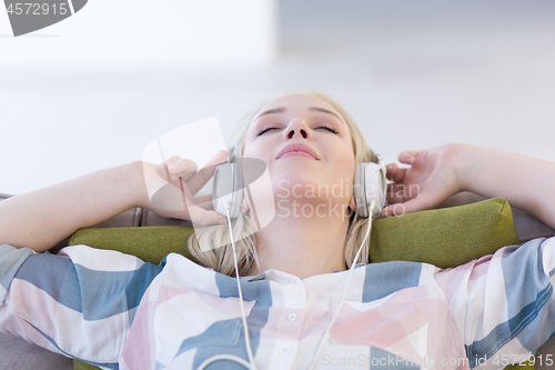 Image of girl enjoying music through headphones