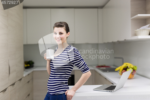 Image of woman drinking coffee enjoying relaxing lifestyle