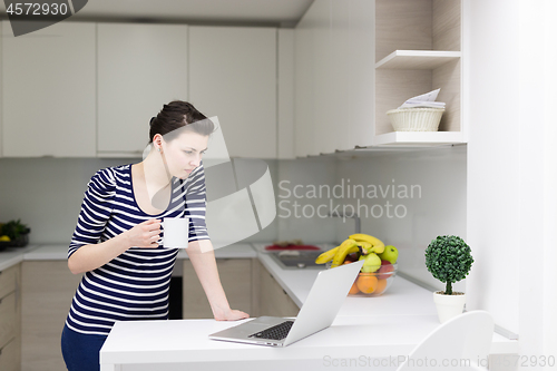 Image of woman drinking coffee enjoying relaxing lifestyle