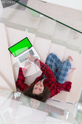 Image of freelancer in bathrobe working from home